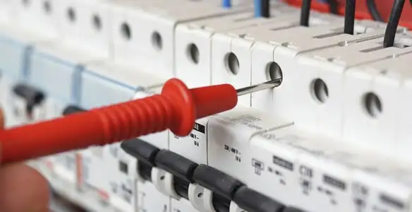 Electrical contractor testing circuit breakers during electrical repair in {area_name}, {area_state_prefix}